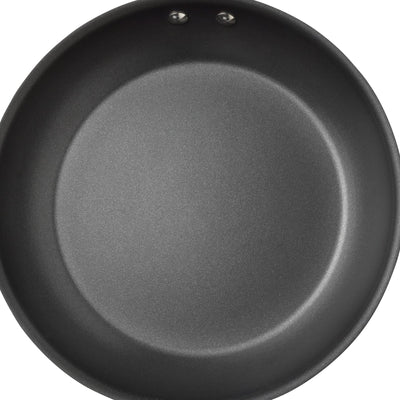 Top view of a black non-stick frying pan on a white background.