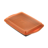 Orange plastic food container with a matching lid, viewed from the top.