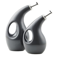 The sleek design of the silver-spouted and handle-opened grey ceramic Rachael Ray 2-Piece EVOO and Vinegar Bottle Set makes it ideal for dispensing your finest EVOO.