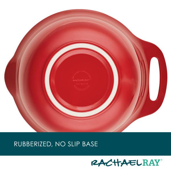 The red dish from the 10-Piece Mix, Measure, and Utensil Set by Rachael Ray is a kitchen essential, featuring a rubberized, non-slip base and handle, complete with the iconic logo.