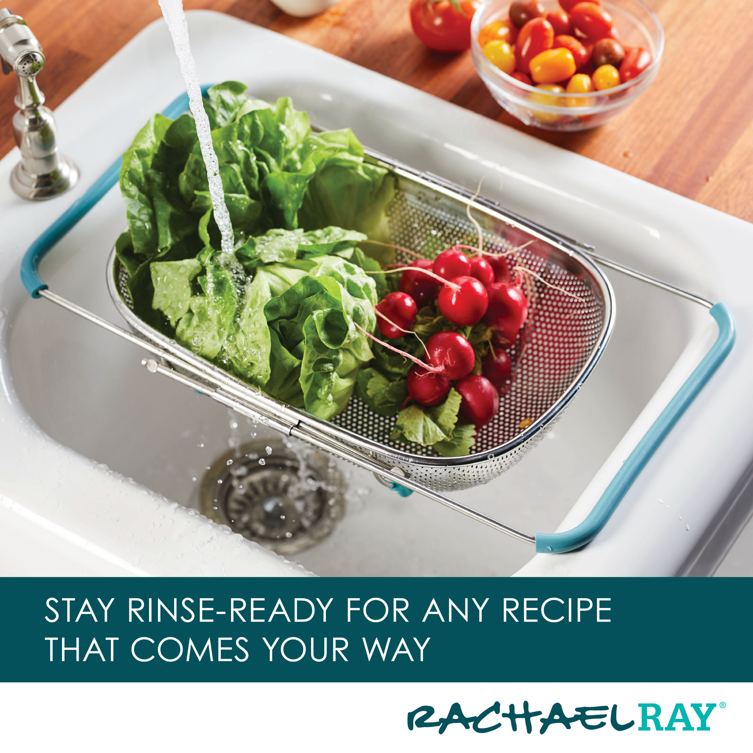 Rinsing vegetables in the 4.5 Quart Over-the-Sink Colander, featuring expandable arms over a sink, with fresh tomatoes nearby.