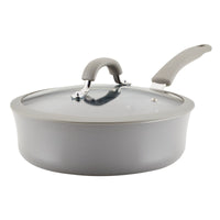 3-Quart Cook + Create Nonstick Sauté Pan with Lid, featuring a gray nonstick surface and a glass lid along with a gray handle, ideal for hassle-free cooking and ensuring even heat distribution. Oven safe for diverse culinary creations.