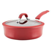 The 3-Quart Cook + Create Nonstick Sauté Pan with Lid, a red saucepan with a handle, is perfect for sautéing and features an oven-safe design for versatile cooking.