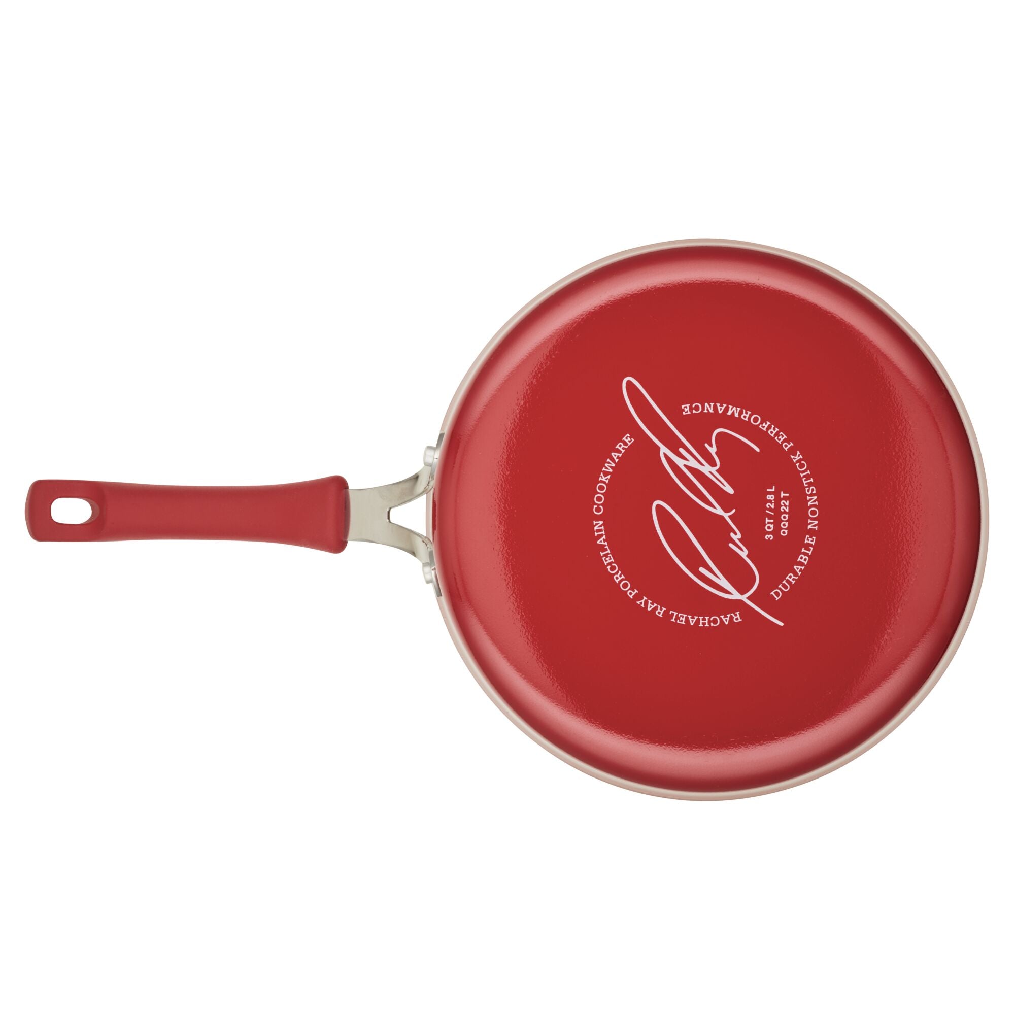 A 3-Quart Cook + Create Nonstick Sauté Pan with Lid in red, featuring a signature on the bottom, a nonstick surface, and a matching red handle.