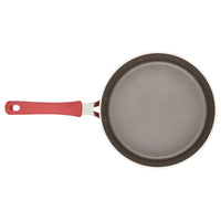 Introducing the 3-Quart Cook + Create Nonstick Sauté Pan with Lid, featuring a stylish red handle and designed on a sleek white backdrop. This pan is ideal for achieving flawless browning and easy cleanup. Its oven-safe construction adds versatility to your kitchen, making it perfect for all your culinary needs.