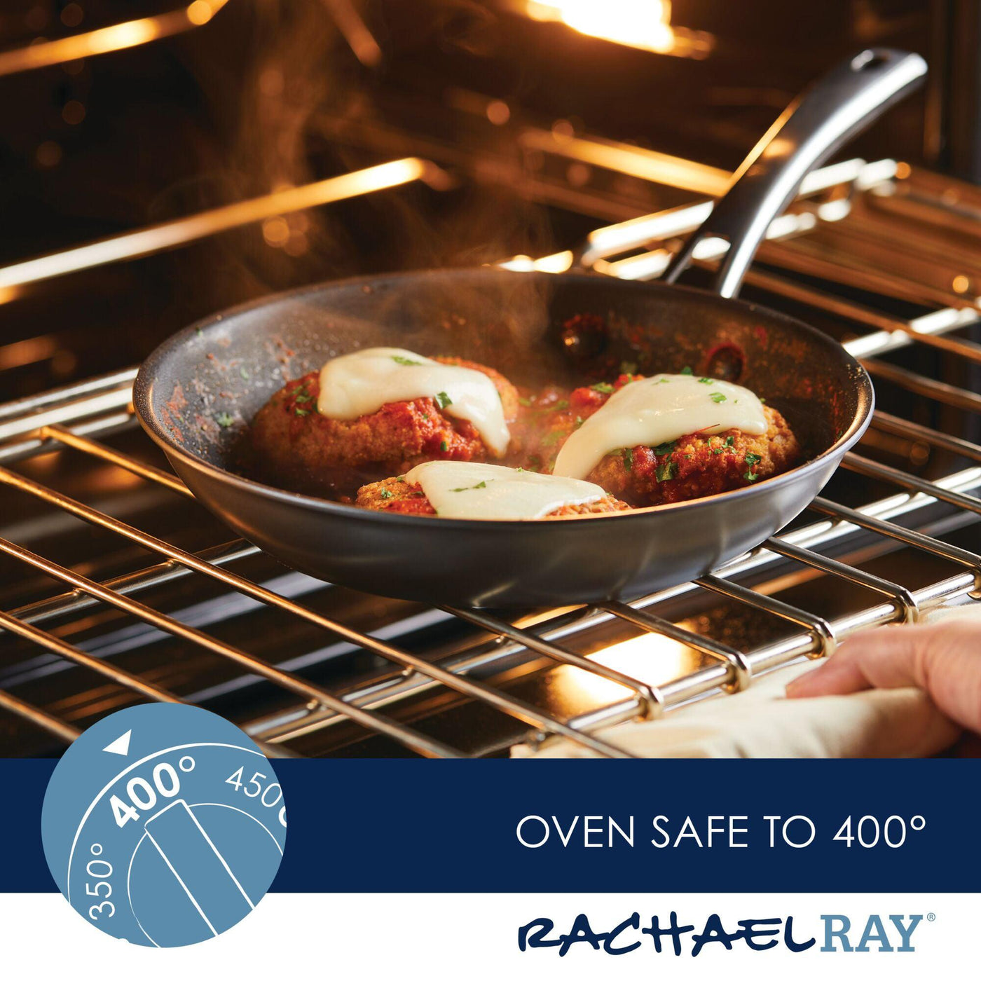 Meatballs with cheese sizzle in a skillet from the Cook + Create Hard Anodized Nonstick Cookware Sets, nestled inside an oven set to 400 degrees.