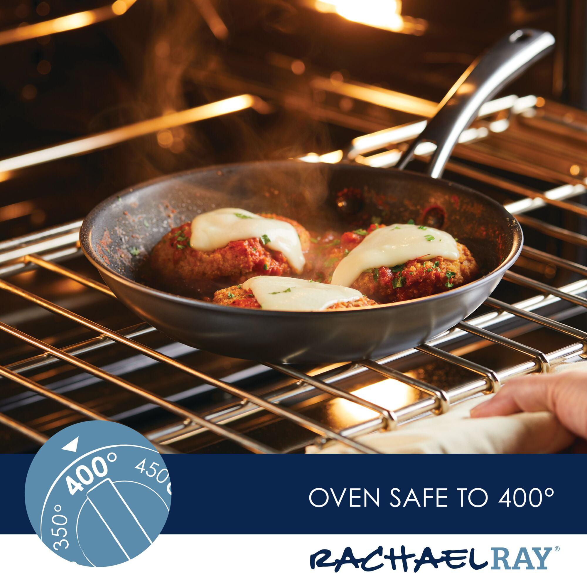 Meatballs with cheese sizzle in a skillet from the Cook + Create Hard Anodized Nonstick Cookware Sets, nestled inside an oven set to 400 degrees.