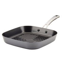 The 11-Inch Cook + Create Hard Anodized Nonstick Deep Grill Pan by Rachael Ray features a ribbed surface and metal handle, crafted from hard anodized aluminum for durability.