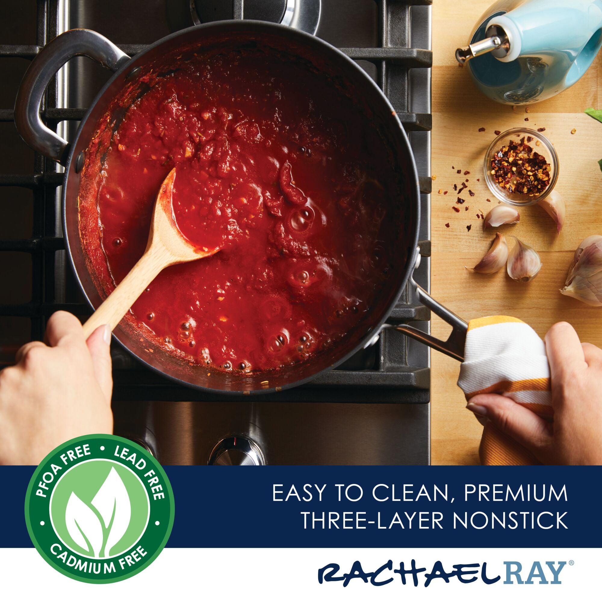 Using the 4.5-Quart Cook + Create Hard Anodized Nonstick Saucier Pan with Lid and Helper Handle on the stove to stir tomato sauce highlights its remarkable triple-layer nonstick surface and branding.