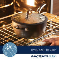The 4.5-Quart Cook + Create Hard Anodized Nonstick Saucier Pan, complete with a lid and helper handle, confidently rests in the oven, demonstrating its oven-safe capabilities up to 400°F. Enjoy stress-free cooking with its triple-layer nonstick surface.
