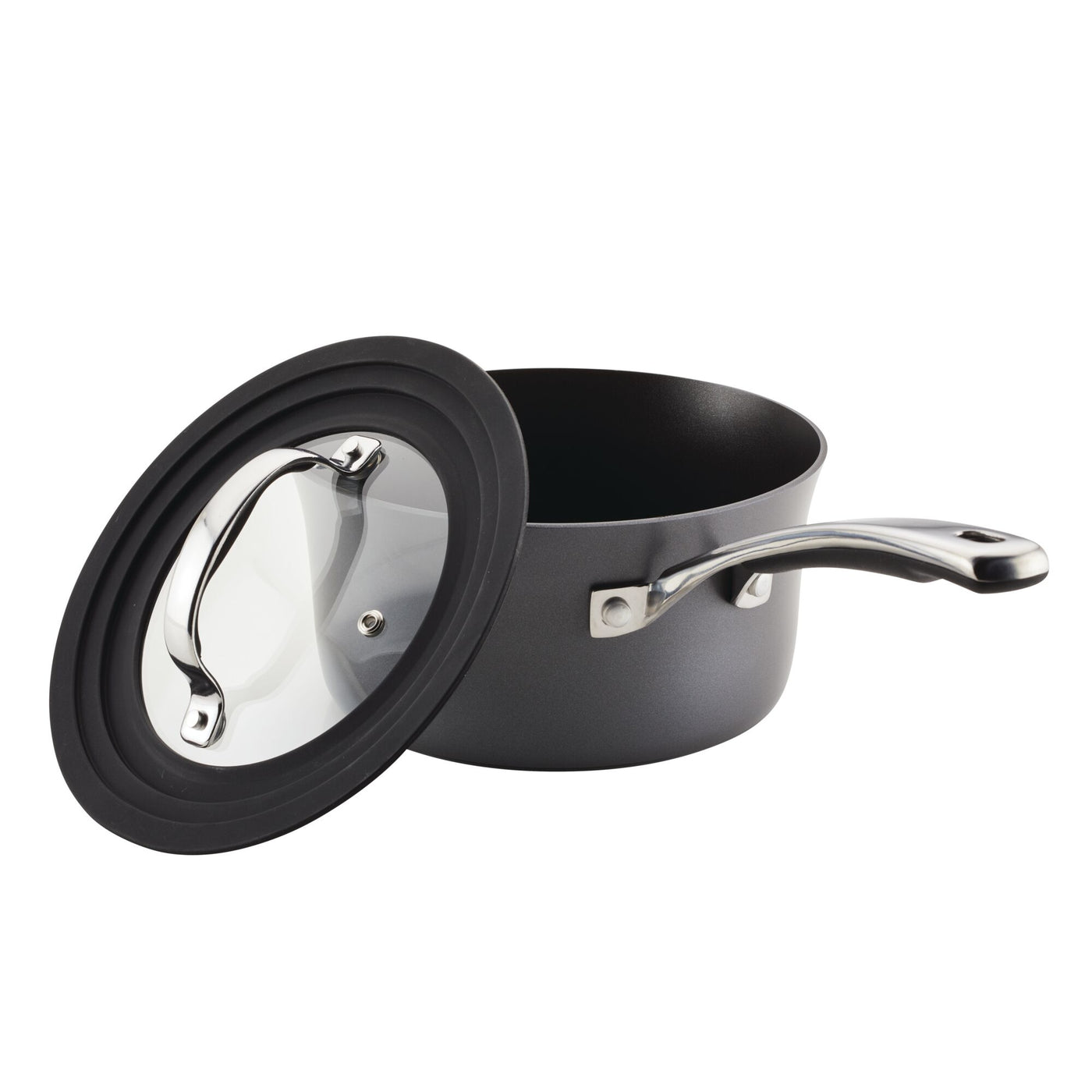 The Cook + Create Hard Anodized Nonstick Cookware Sets include a hard-anodized aluminum saucepan with a tempered glass lid, partially open.