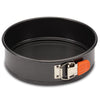 9-Inch Nonstick Springform Pan made from heavy gauge steel, equipped with a round design and an orange latch on the side for easy food release.