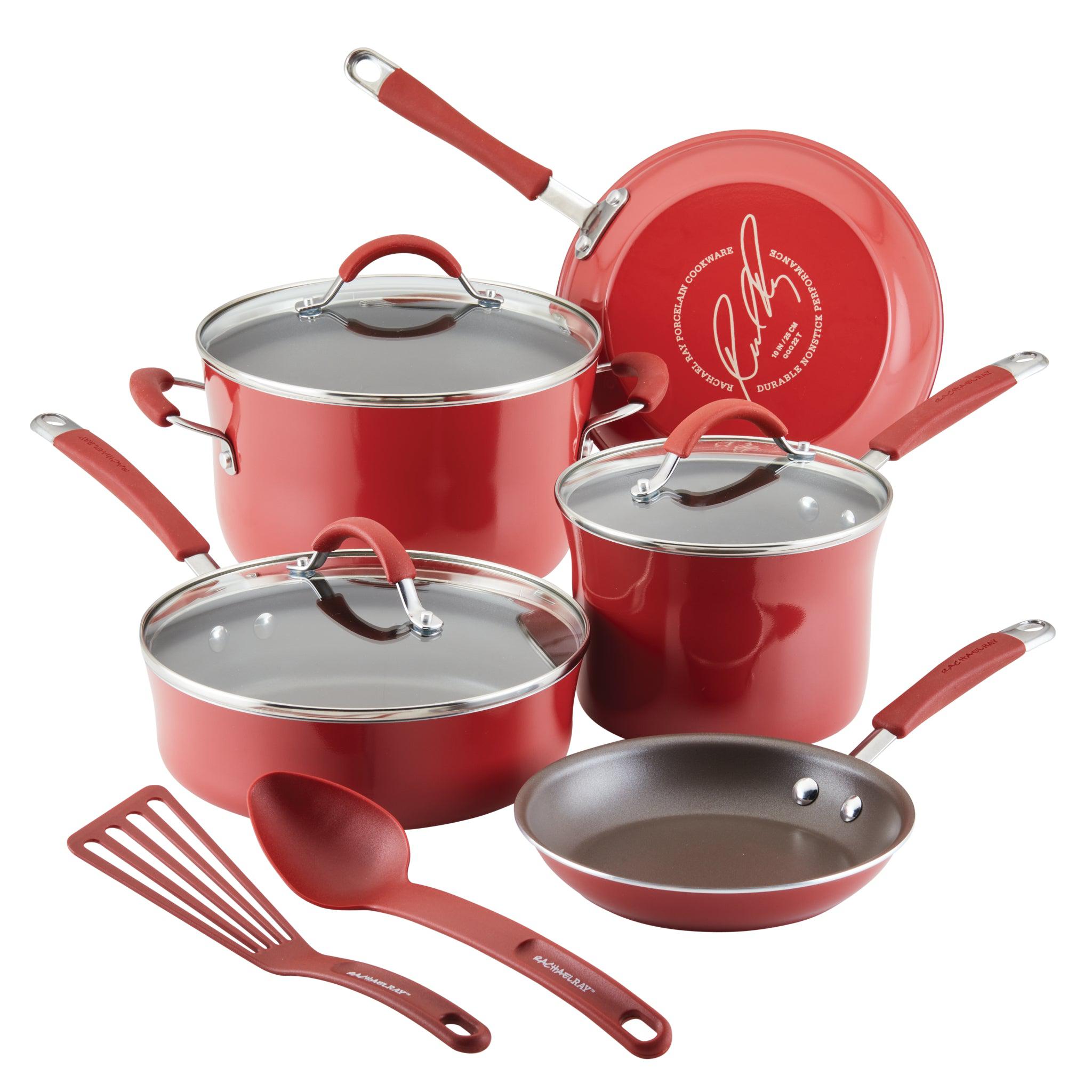 The vibrant red 10-Piece Cucina Nonstick Cookware Set by Rachael Ray features nonstick pots and pans, shatter-resistant glass lids, and essential utensils on display.