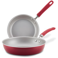 Set of 9.5" & 11.75" red nonstick induction fry pans, stacked together.