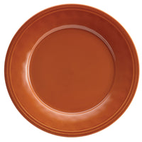 A handcrafted textured ceramic plate in orange, featuring a plain round design, viewed from above, part of the 16-Piece Dinnerware Set.