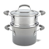 The 3-Quart Classic Brights Nonstick Covered Steamer Set features a stainless steel saucepot with a glass lid and grey handles, ideal for steaming vegetables or creating the perfect pasta dish.