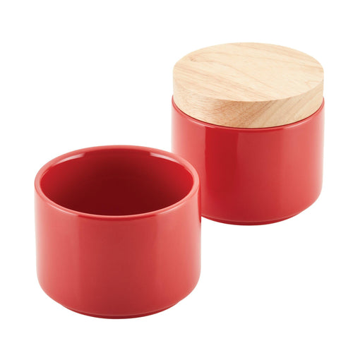 The Stacking Spice Box Set features two ceramic containers with wooden lids, designed to be perfect for stacking in your kitchen, with one open and one closed configuration.