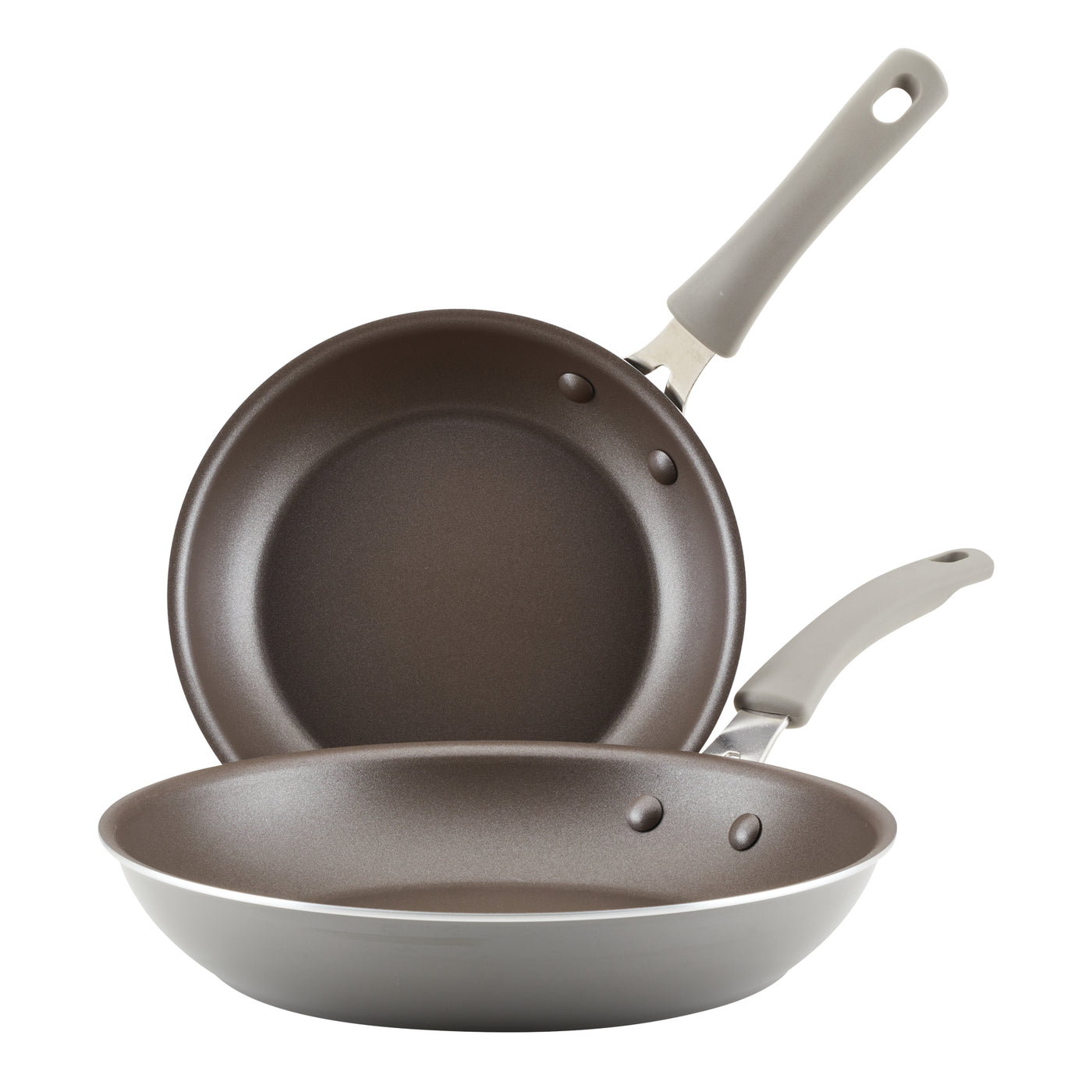 The two frying pans from the 2-Piece Cook + Create Nonstick Frying Pan Set, crafted in gray aluminum with handles and gleaming nonstick surfaces, are neatly stacked one above the other.
