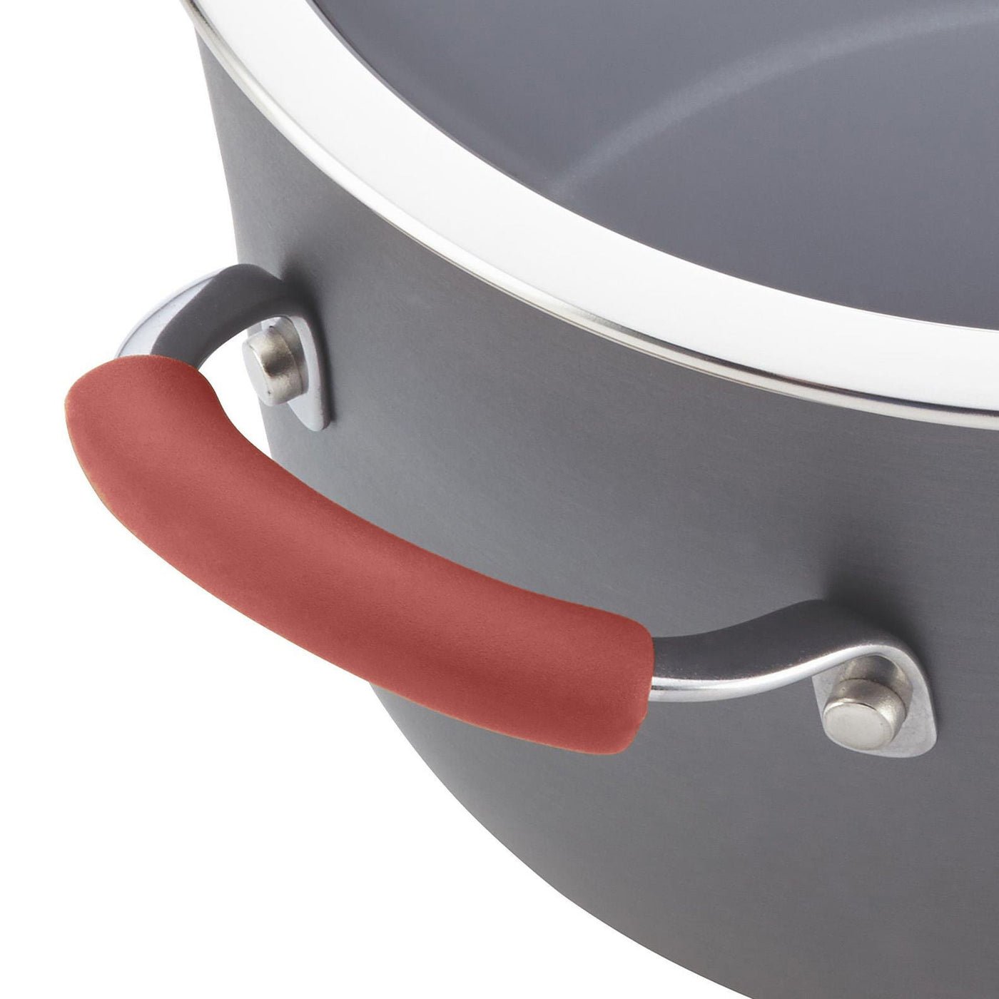 A resilient aluminum pot from the 12-Piece Cucina Hard Anodized Nonstick Cookware Set, complete with a red silicone grip on the handle, guarantees easy food release.