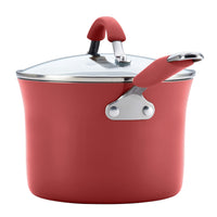This sturdy aluminum pot from the 12-Piece Cucina Nonstick Cookware Set comes with a glass lid and coordinating red handles on both the lid and pot, providing an elegant appearance along with nonstick practicality.