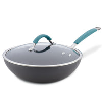 An 11-Inch Cucina Hard Anodized Nonstick Covered Stir Fry pan, made from durable aluminum, includes a glass lid and turquoise handle, and is enhanced with PlatinumShield Technology.