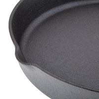 Close-up of the 12-Inch NITRO Cast Iron Skillet, featuring pre-seasoning, a pouring spout, and enhanced with nitro heat treatment.