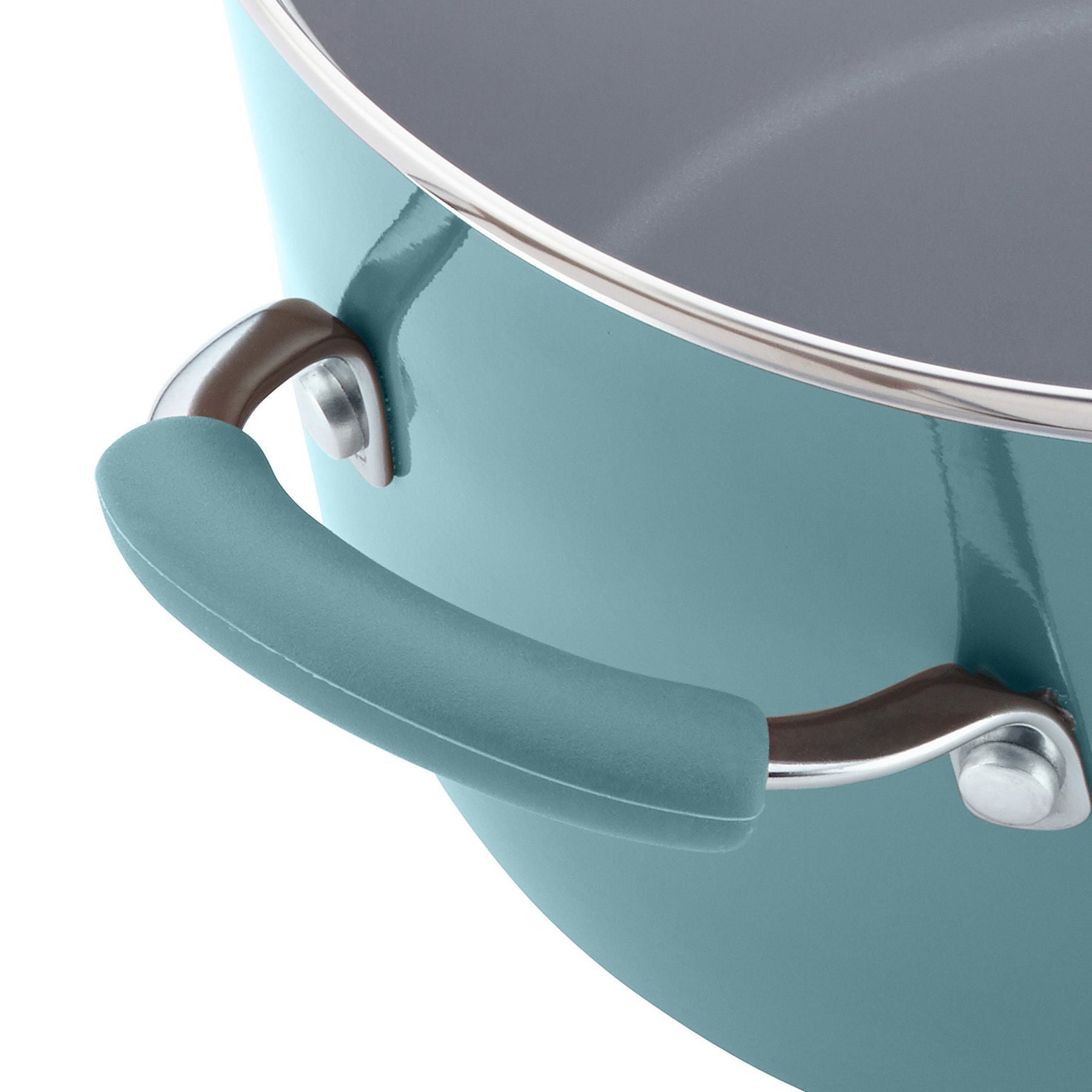 Close-up of a teal piece from the 12-Piece Cucina Nonstick Cookware Set, featuring a metal rim and handle, made from durable aluminum.