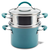 The 3-Quart Cucina Nonstick Covered Steamer Set is a durable aluminum cookware set that includes a teal pot with a nonstick surface and a versatile multi-pot steamer insert.