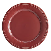 This piece from the 16-Piece Dinnerware Set is a red plate featuring a glossy finish and a handcrafted texture, presented from a top-down perspective.