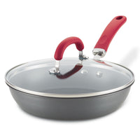 10.25-Inch nonstick induction frying pan with glass lid and red handle shown.