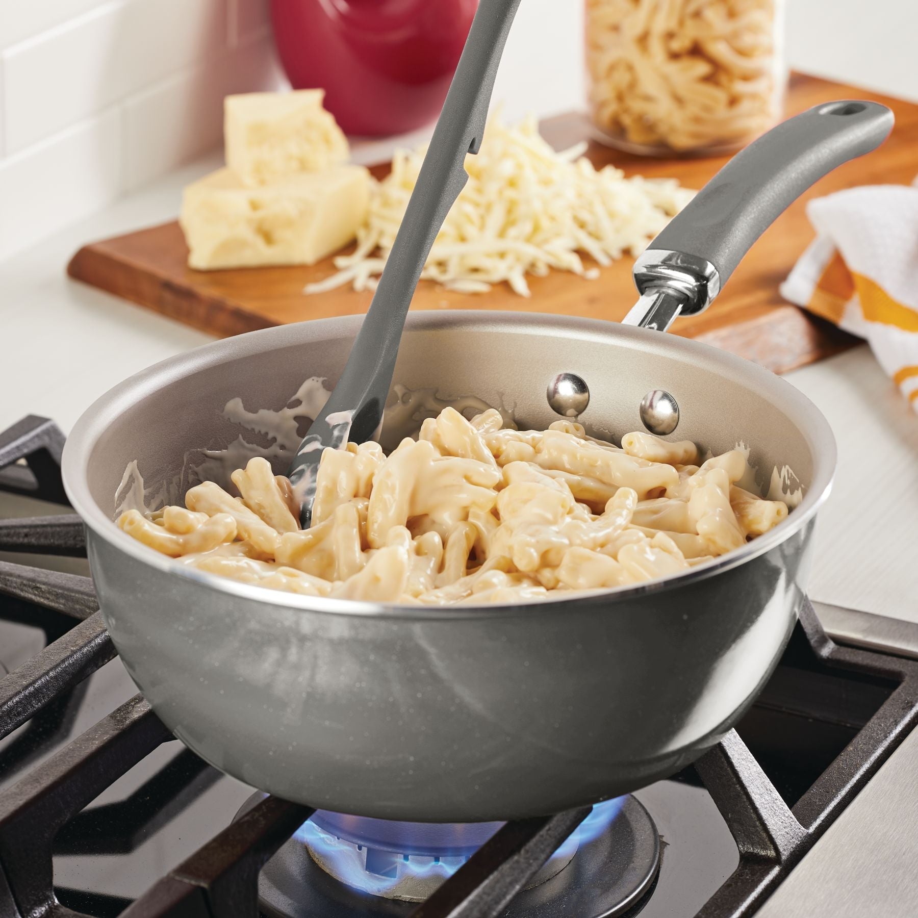 Macaroni and cheese cooking in a 3-Quart Nonstick Induction Chef Pan on stove.
