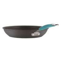 A side view of a frying pan from the 12-Piece Cucina Hard Anodized Nonstick Cookware Set, featuring a teal handle and constructed with durable aluminum.