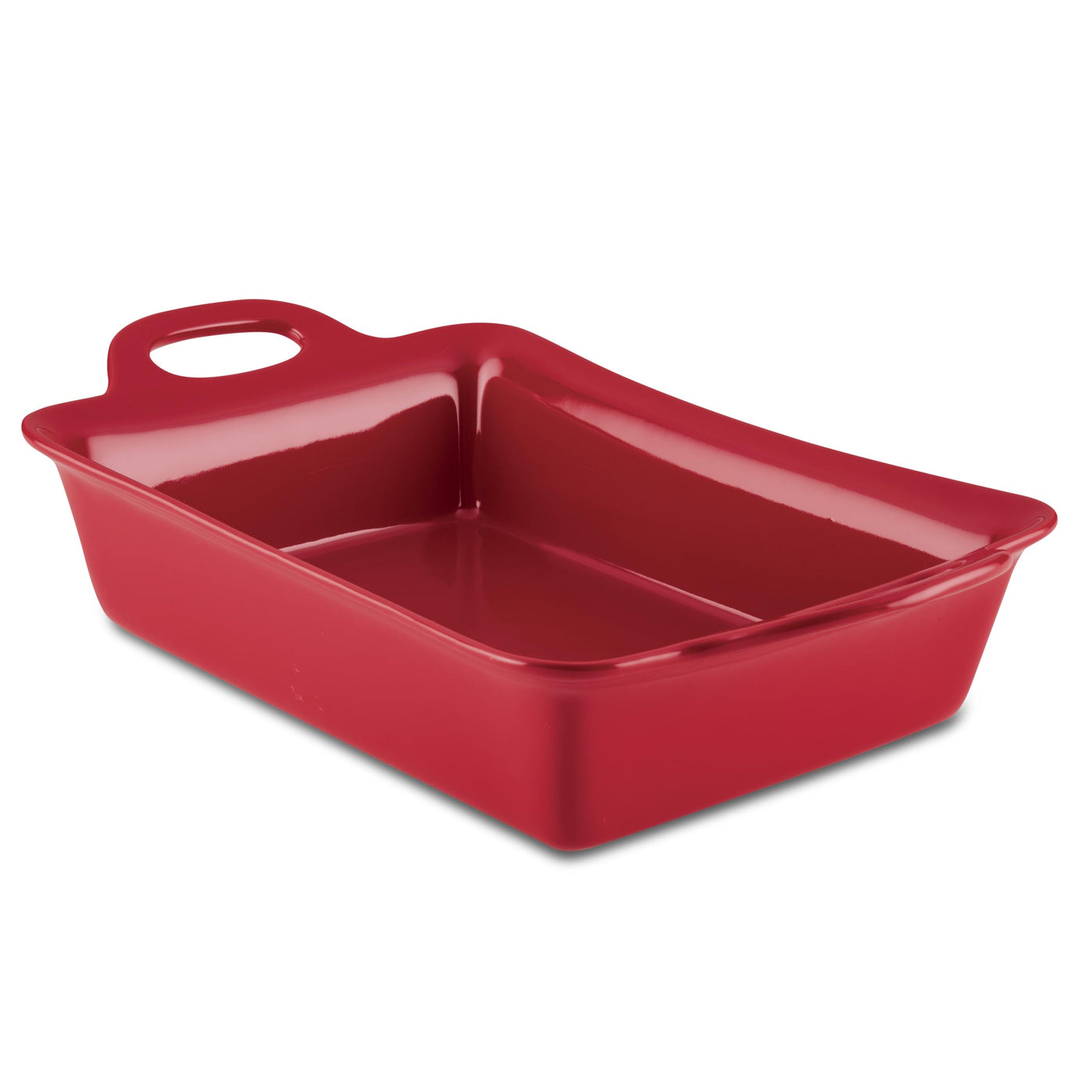 The 9-Inch x 13-Inch Ceramic Baker is a red rectangular dish made from ceramic, equipped with a convenient handle on one end and designed for oven safety.