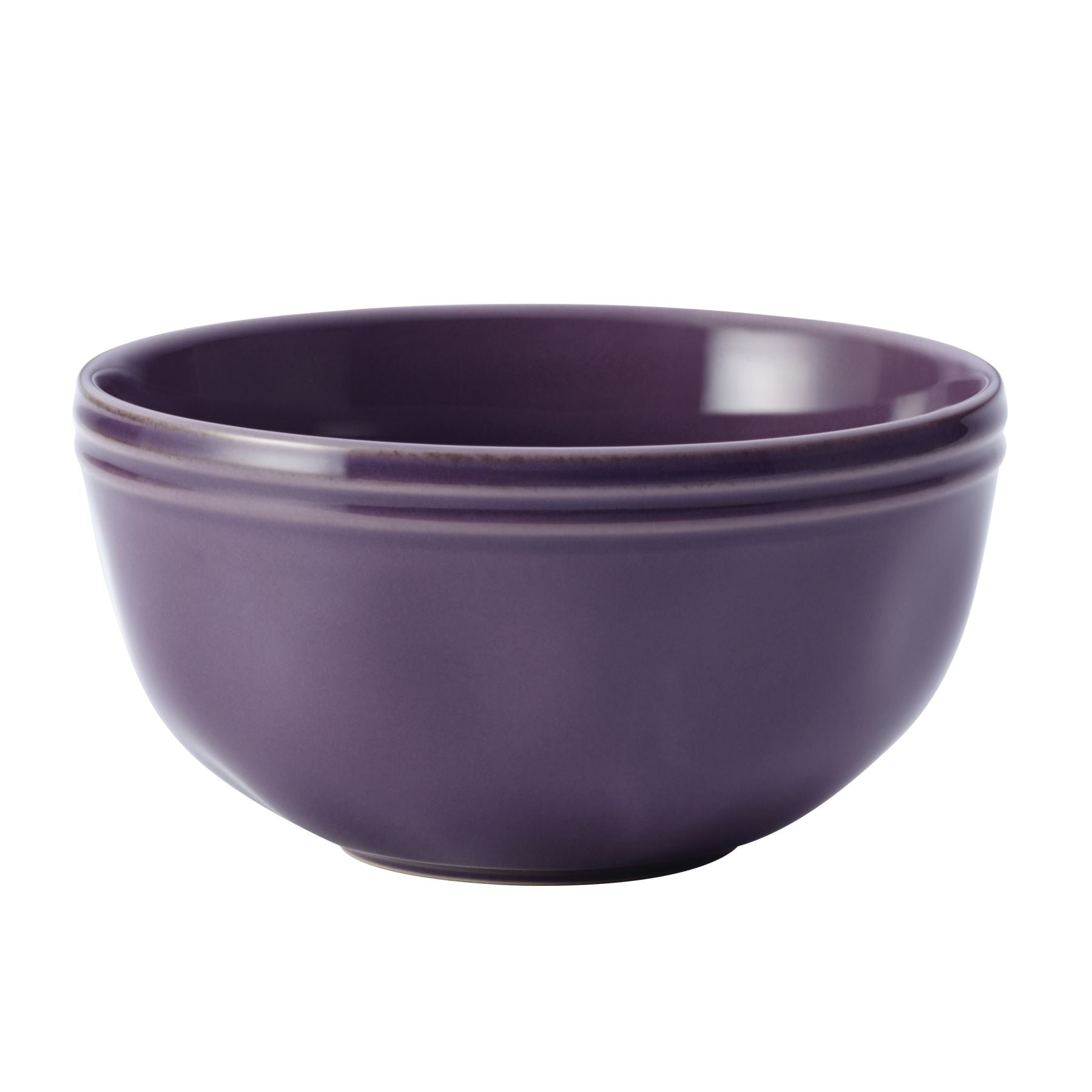 The 16-Piece Dinnerware Set includes a purple ceramic bowl with smooth edges and a glossy finish, boasting a handcrafted texture that adds uniqueness to your collection.