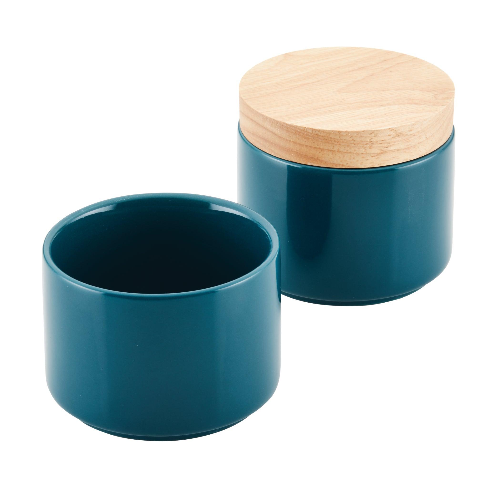 The Stacking Spice Box Set includes two teal ceramic spice boxes that are ideal for stacking, with one featuring a stylish wooden lid.